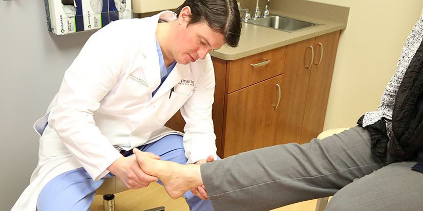 doctor examining a foot