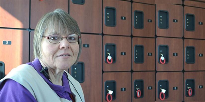 woman standing next to lockers