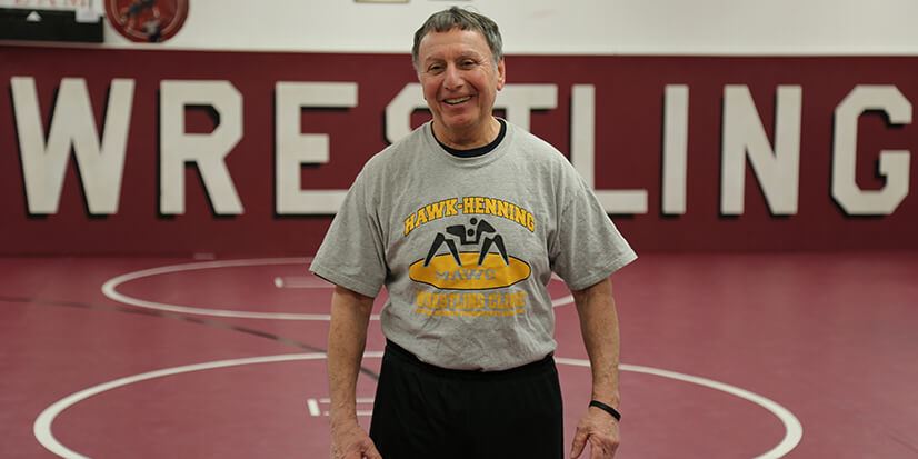 man standing in a wrestling rink