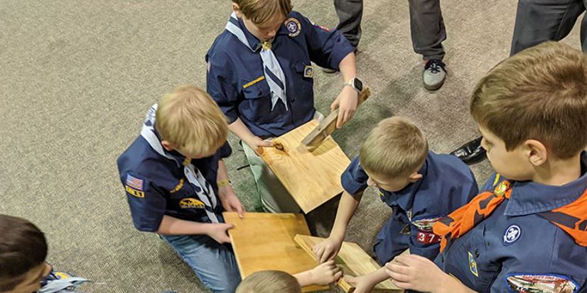 boy scouts working on wood