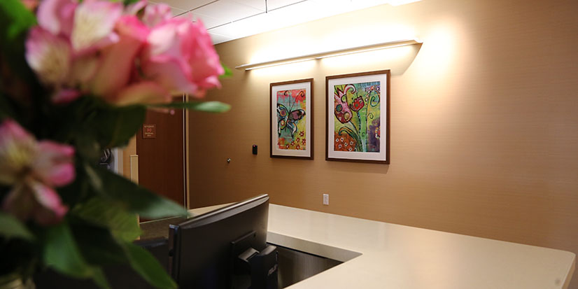 reception desk with flowers on it