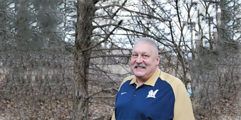 man standing outside in the woods