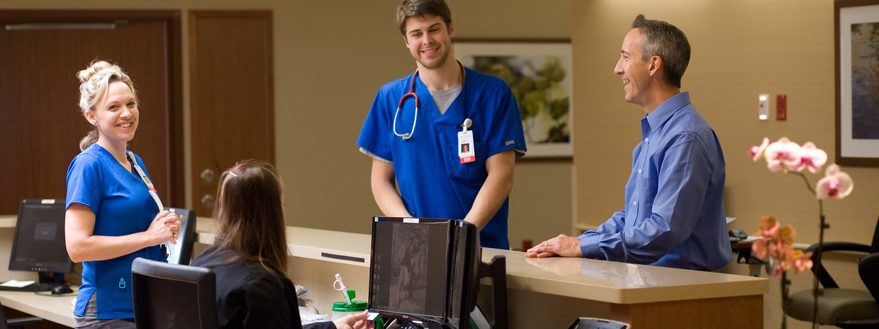 employees talking at desk