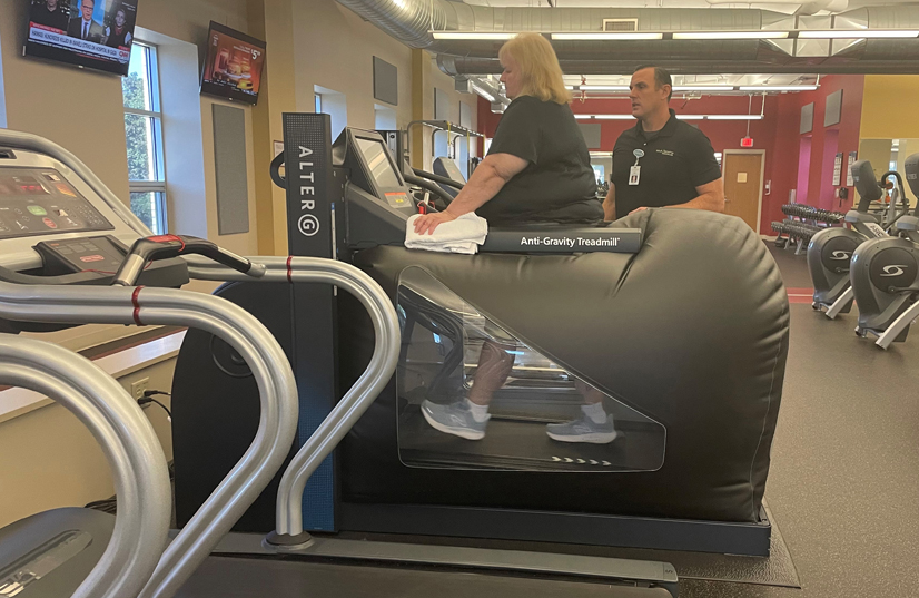 Woman walking on antigravity treadmill