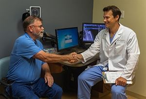 doctor shaking hands with patient