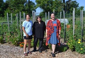 three people in garden