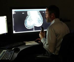 Dr Looking at Mammogram